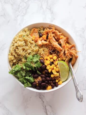 Instant Pot Salsa Chicken Quinoa Bowls are a healthy weeknight dinner or an easy meal prep. Let the Instant Pot do the work cooking the chicken thighs while you prepare the easy cilantro lime quinoa. Using pantry staple ingredients makes this super easy to make. 