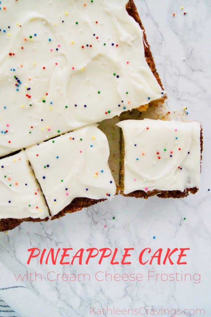 Pineapple cake with cream cheese frosting cut into pieces
