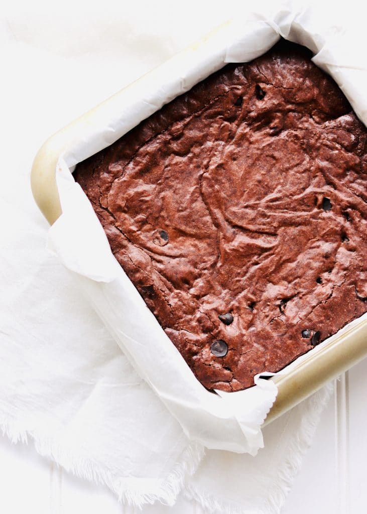 uncut baked brownies in pan