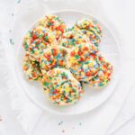 Drop Sugar Cookies that are soft, chewy and filled with lots of sprinkles. No rolling or cutting. Just roll the simple cookie dough into balls and bake. Recipe at KathleensCravings.com #sugarcookies #dropsugarcookies #holidaycookies #christmascookies #baking #holidaybaking #easysugarcookies #sprinkles
