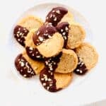 Brown Butter Almond Shortbread Cookies are perfect to make for the holidays. Drizzling or dipping the shortbread cookies in melted chocolate takes them over the top! Just slice the cookie dough log into cookies and bake. Recipe at KathleensCravings.com #kathleenscravings #shortbreadcookies #cookies #brownbutter #christmascookies #holidaycookies
