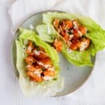 Buffalo Cauliflower Lettuce wraps are so simple and easy to make. Perfect for satisfying your buffalo craving in a healthy, plant-based, meatless way. Perfect as an appetizer or as part of a Meatless Monday dinner. Recipe at KathleensCravings.com #kathleenscravings #meatlessmonday #plantbased #cleaneating #vegetarianappetizer #buffalolettucewraps #cauliflowerrecipes
