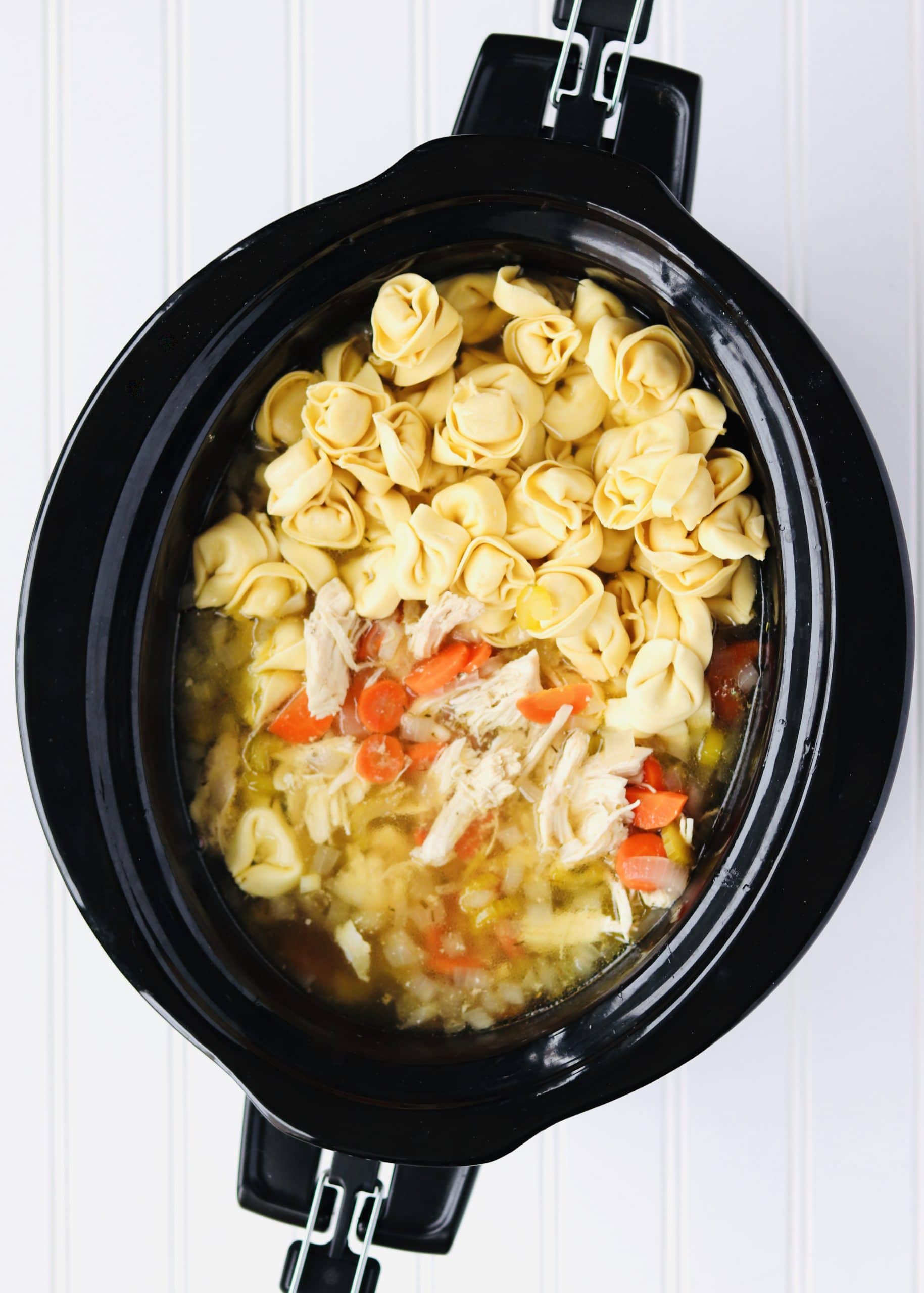 Chicken soup with tortellini in slow cooker