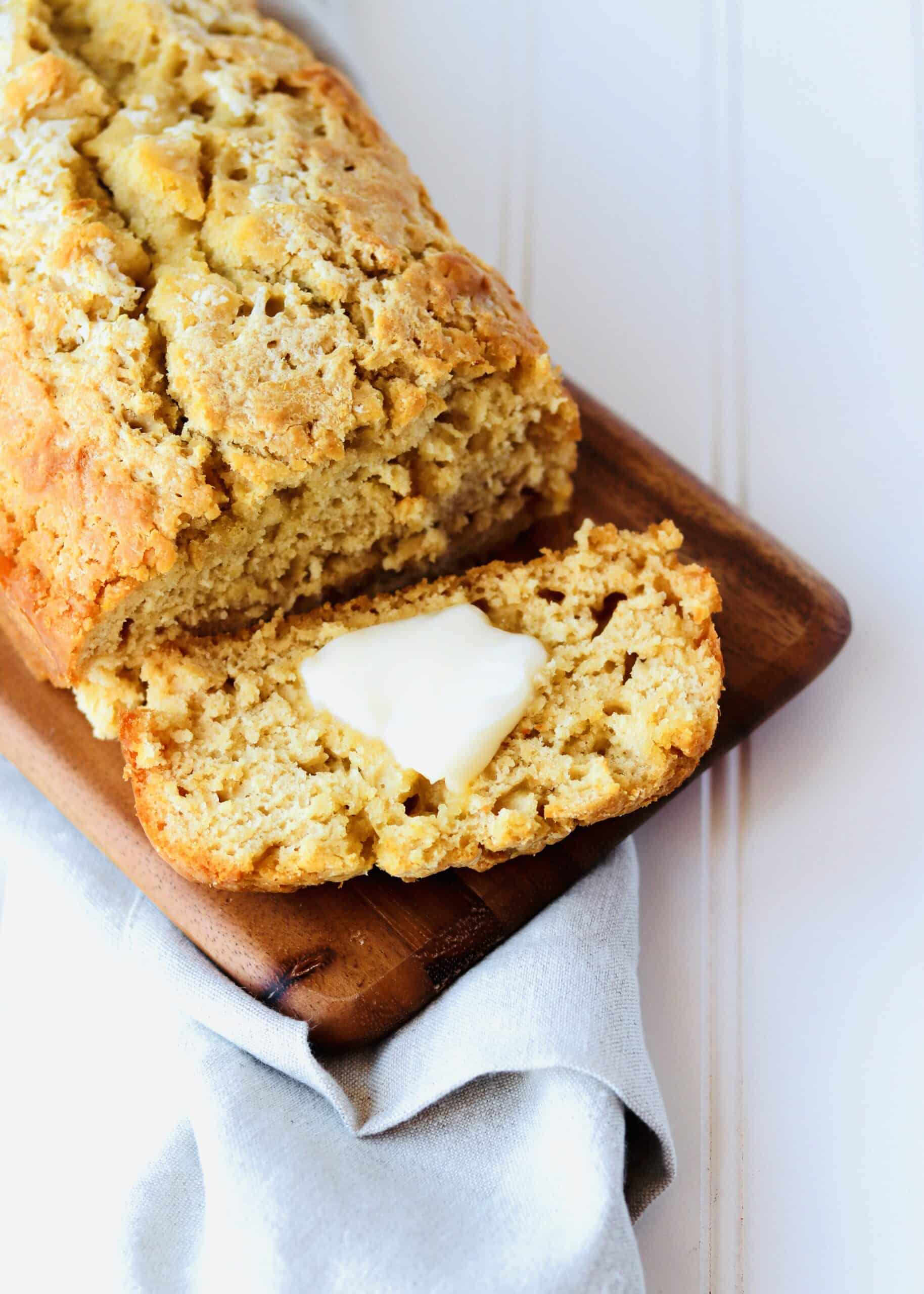 Honey Beer Bread is a super simple quick bread. Just 5 ingredients! The beer flavor is very mild and the bread is dense, moist, and ready for a slather of butter and drizzle of honey.