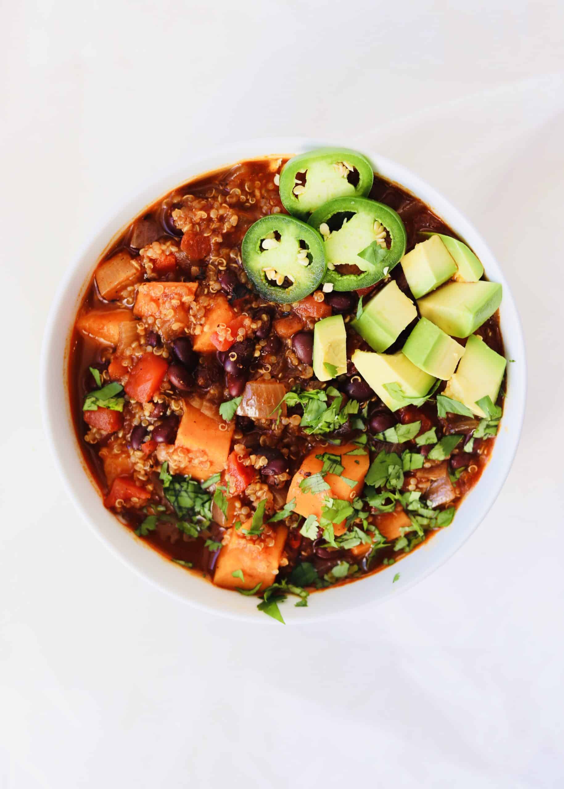 Sweet Potato Black Bean Chili is an easy vegetarian and vegan chili for your busy weeknights. It all comes together in one pot. Healthy and packed with flavor for Meatless Monday.