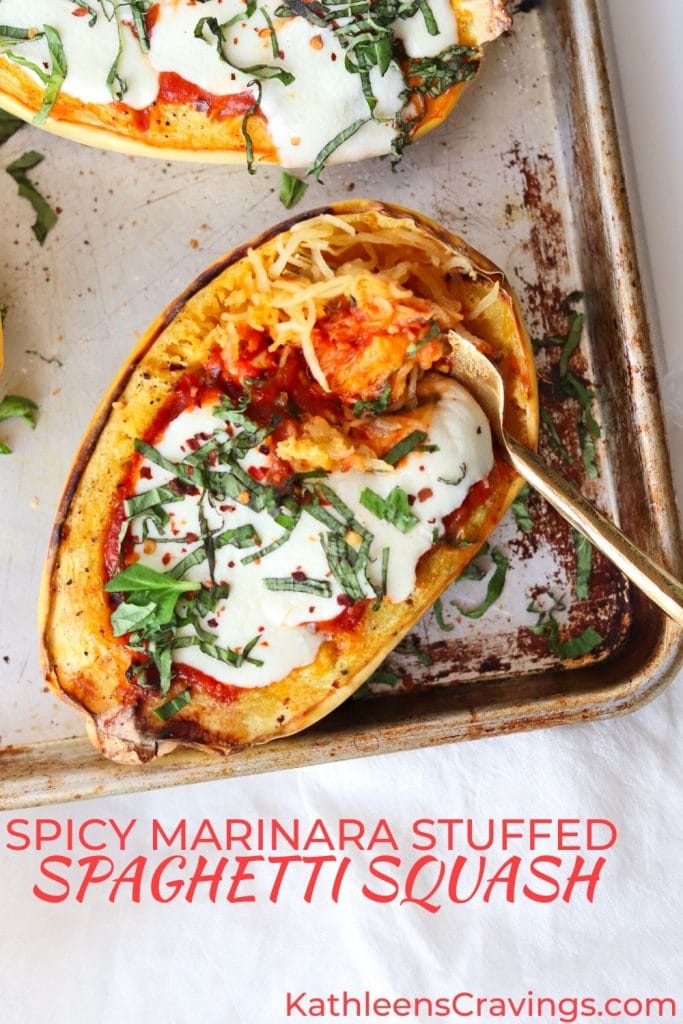 spicy marinara stuffed spaghetti squash with fork and text overlay