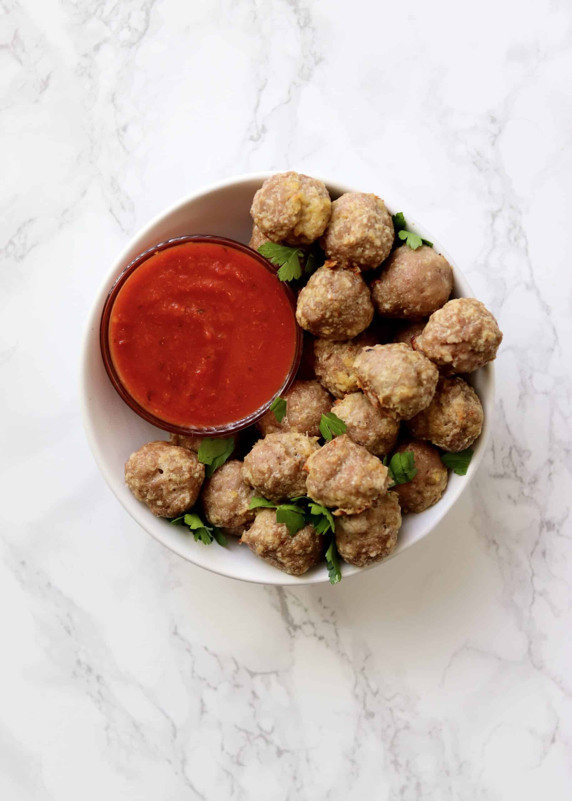 Baked Turkey Meatballs are healthy and require just a few simple ingredients. Just mix them up, roll, and bake! They're versatile and freezer friendly! You can freeze them before or after baking.
