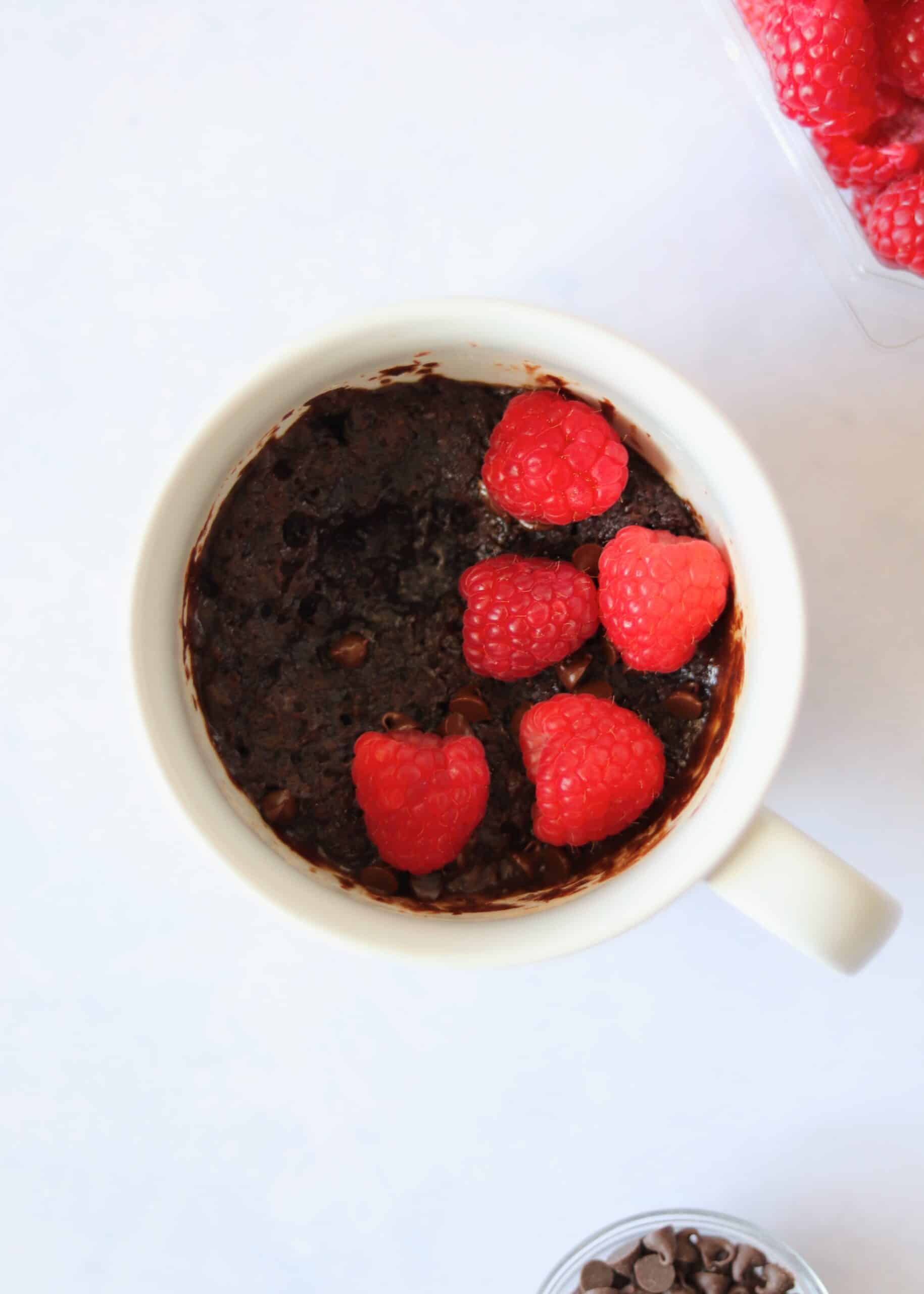 Molten chocolate microwave mug cake with raspberries