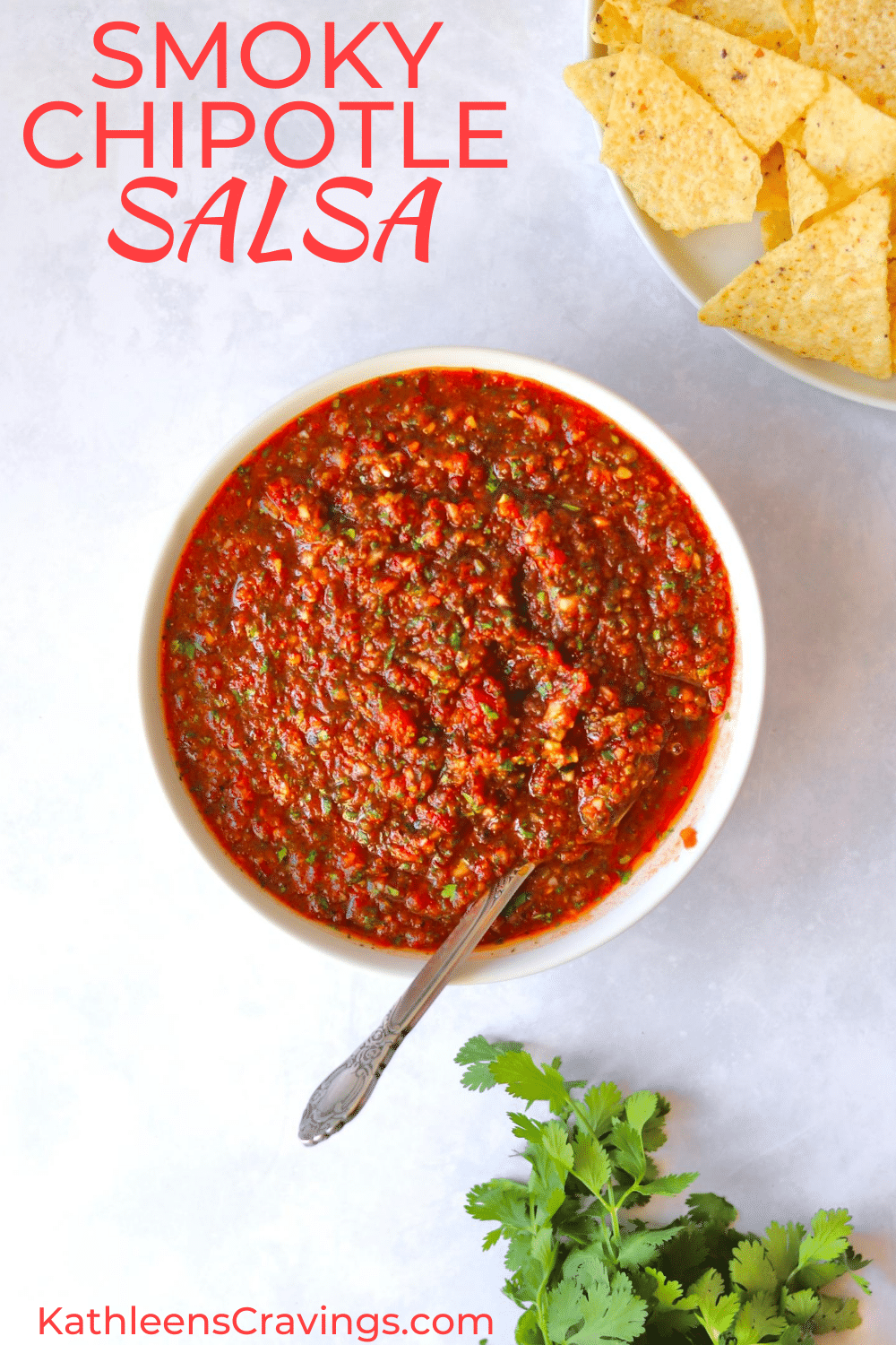 Smoky chipotle salsa in bowl with chips and cilantro and text overlay