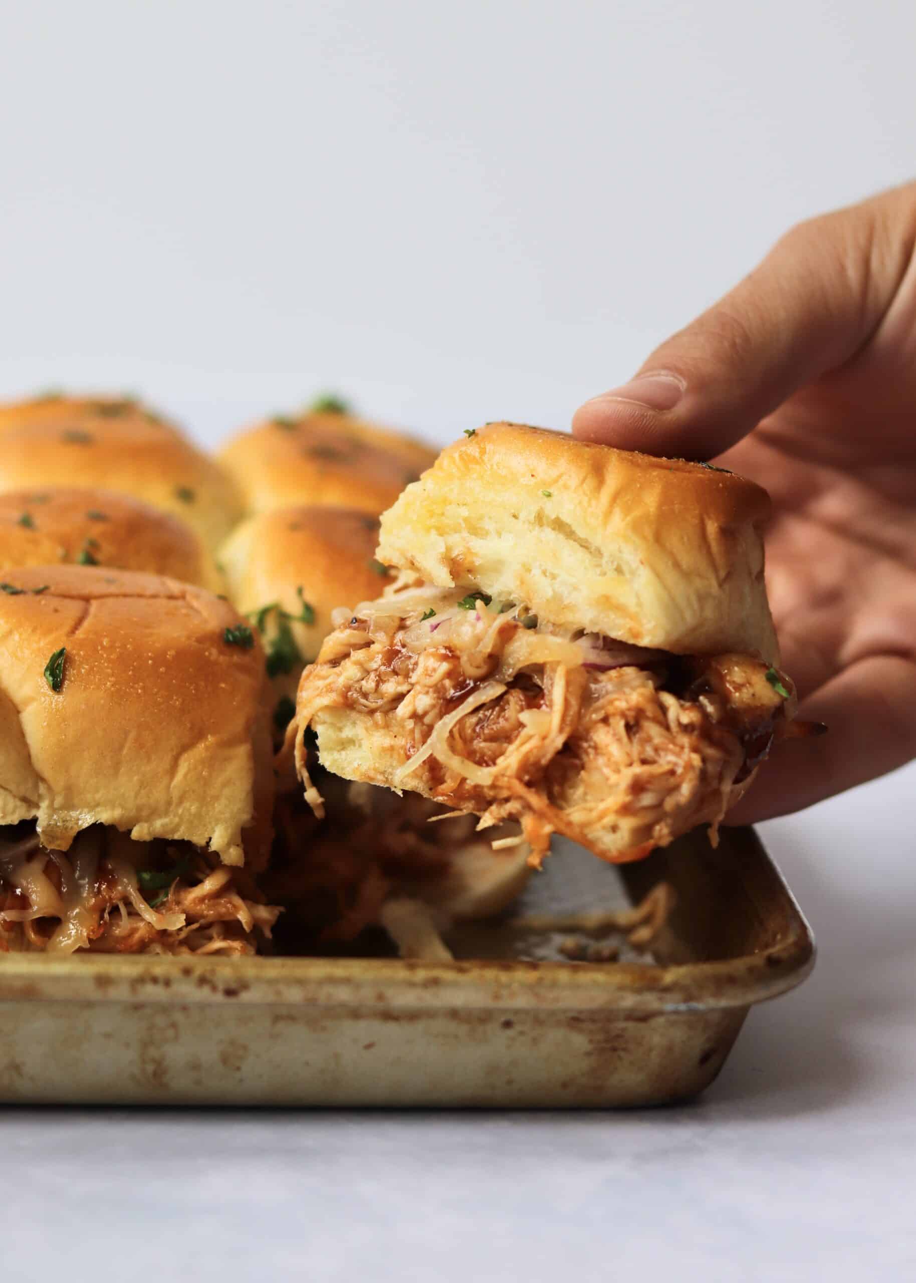 https://kathleenscravings.com/wp-content/uploads/2020/08/BBQ-Chicken-Sliders-hand-2-scaled.jpeg