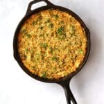 Jalapeno Popper Dip in cast iron skillet with parsley