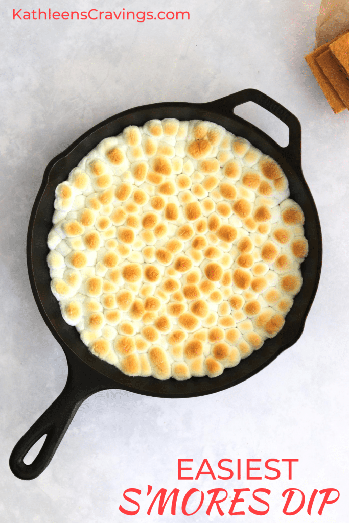 Baked S'mores dip in skillet with text overlay