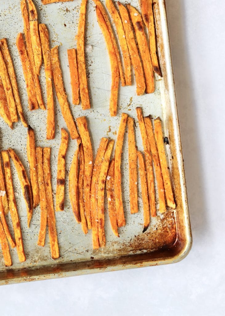 Sweet potato fries on a sheet pan