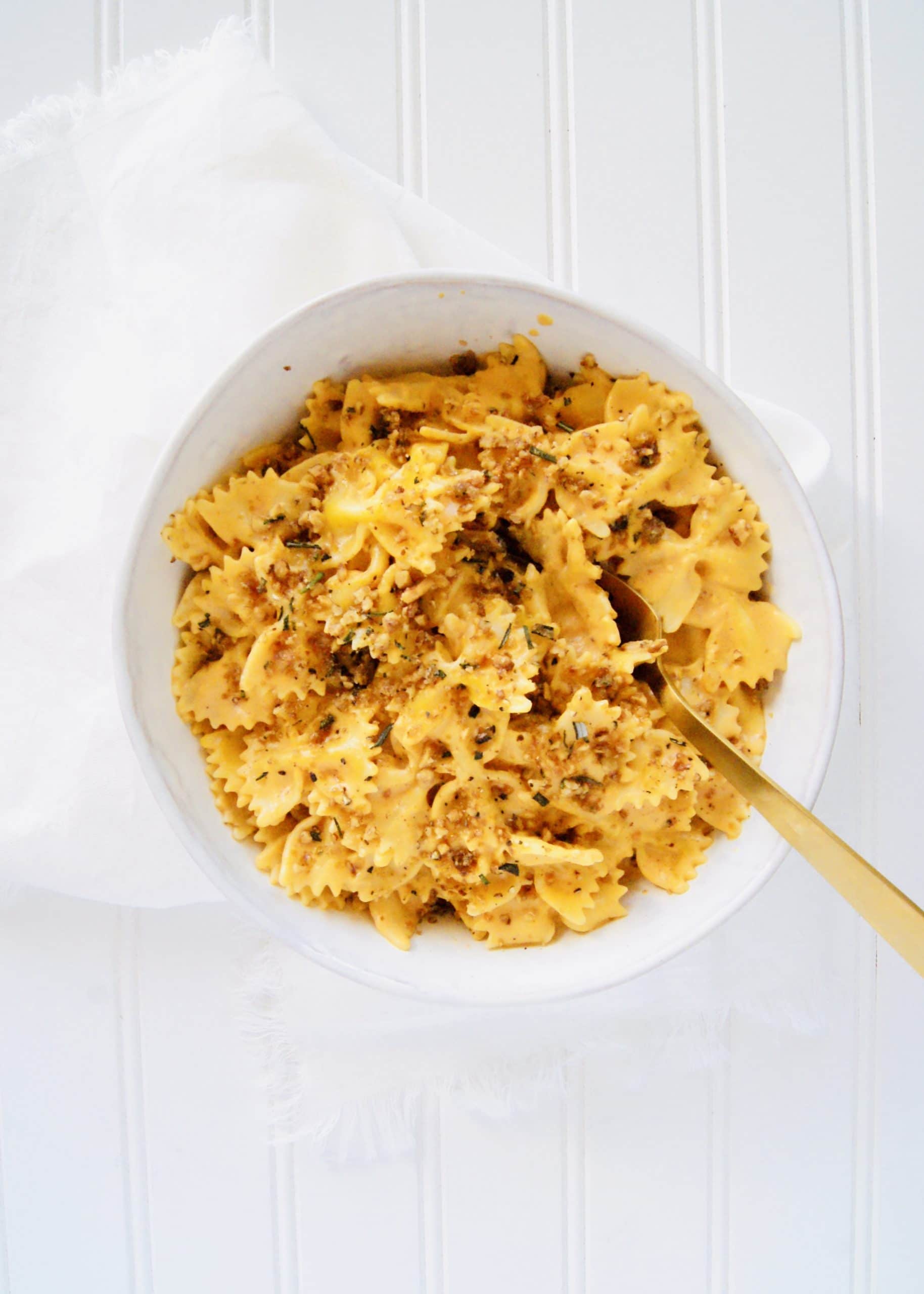 Bowl of Pumpkin Pasta with herbed walnuts on top