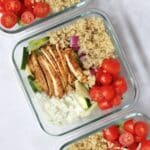 Greek chicken, quinoa, tzatziki, and veggie in meal prep containers