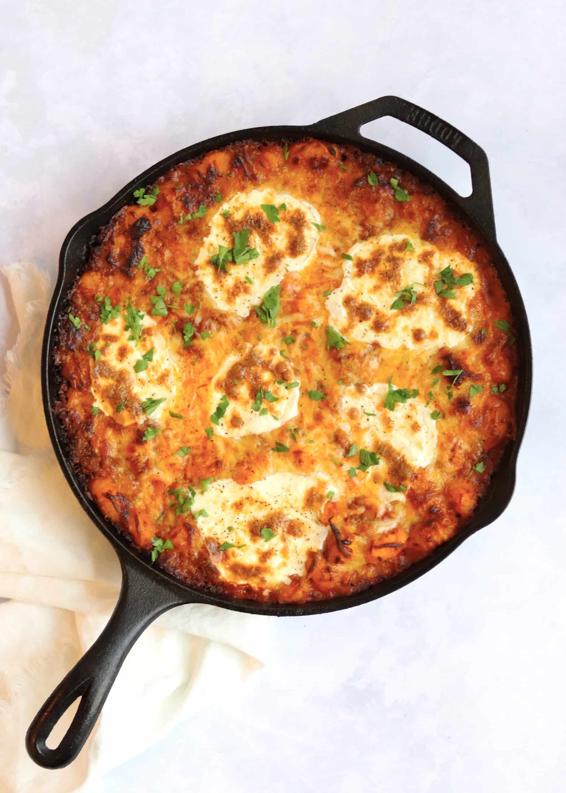 Cheesy sausage baked gnocchi in skillet