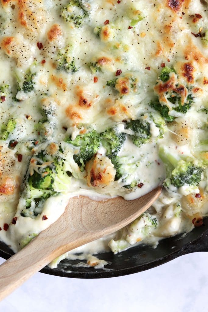 Cheesy broccoli gnocchi baked in a cast iron skillet