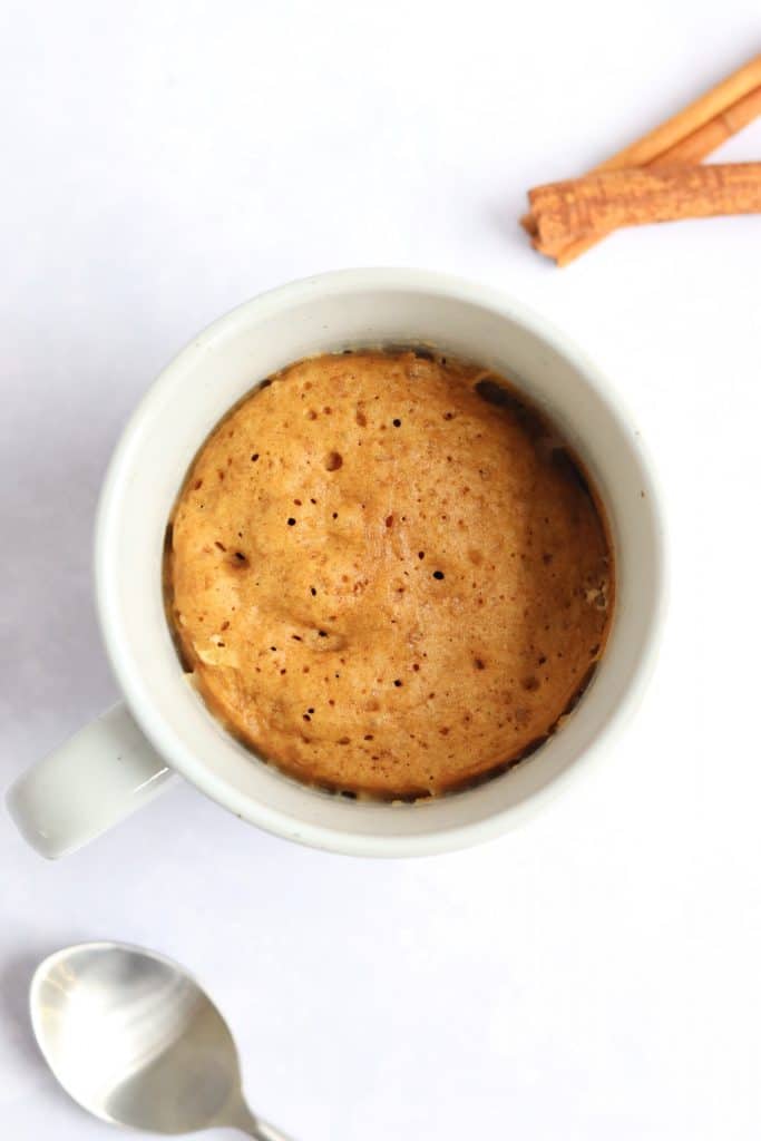 Gingerbread microwave mug cake with cinnamon sticks