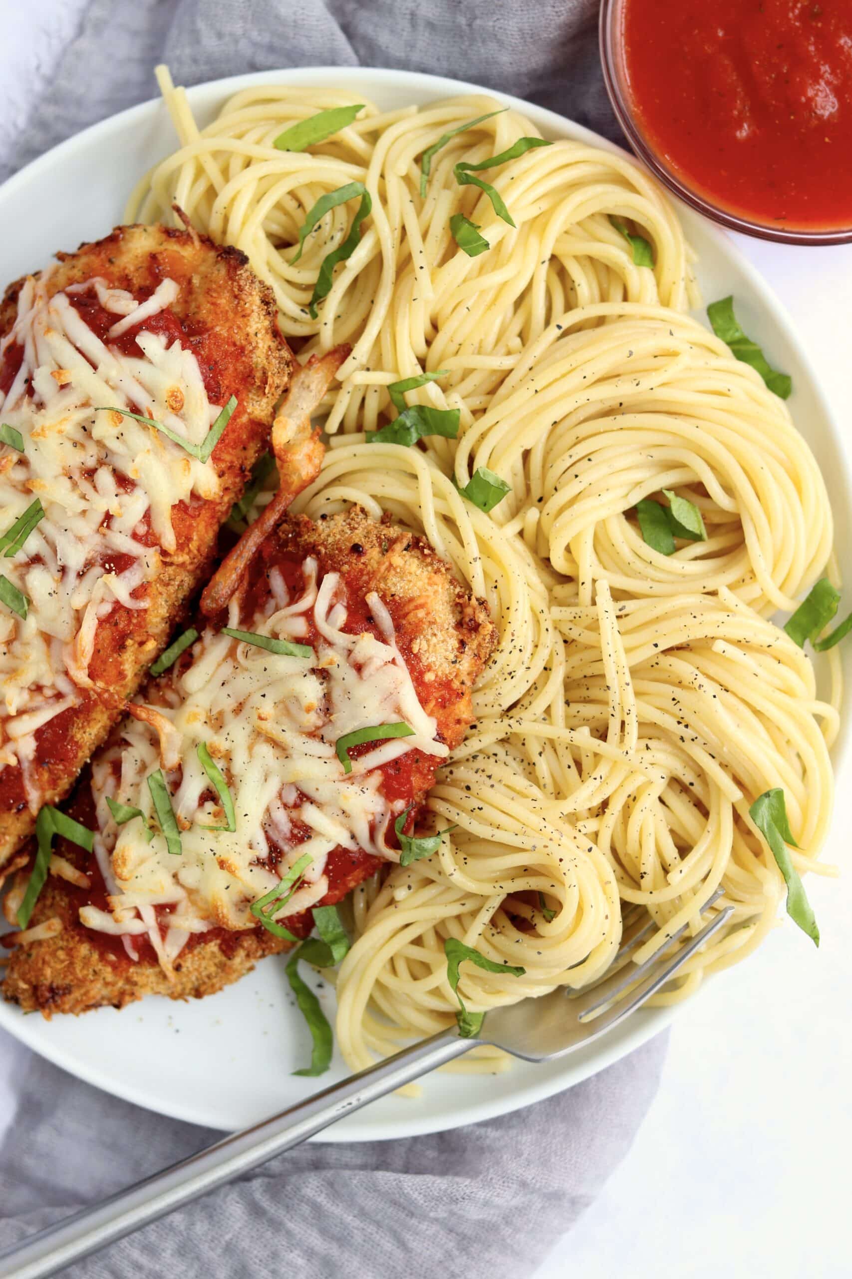 Plate of air fryer chicken parmesan with pasta