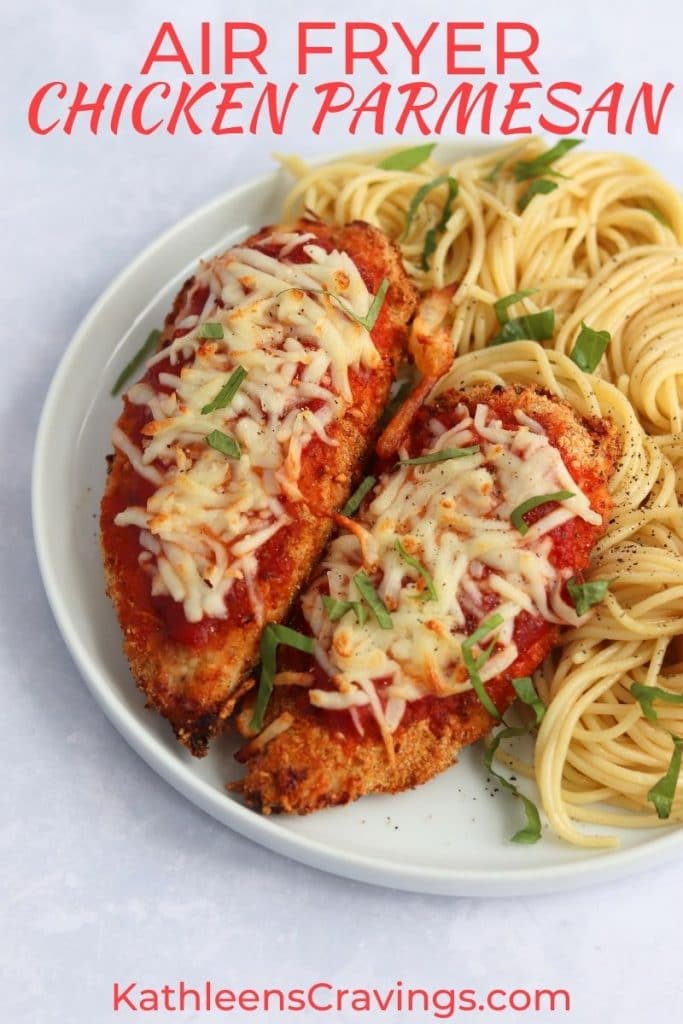 Chicken parmesan on a plate with spaghetti