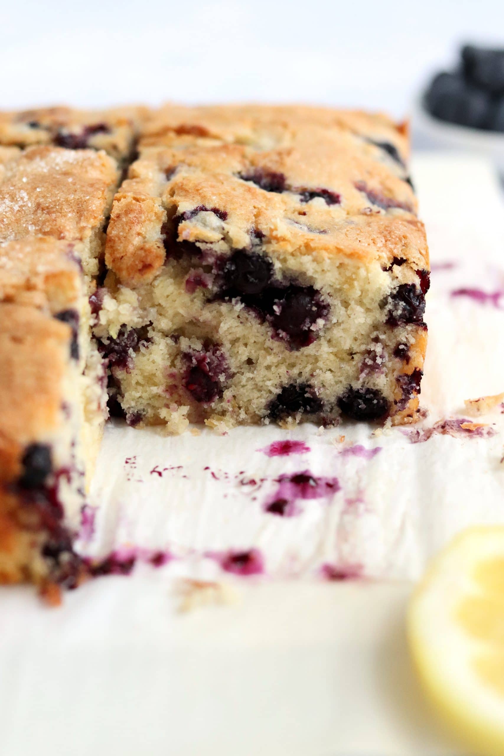 Lemon blueberry breakfast cake cut into slices. 