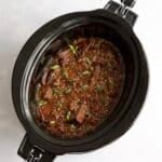 Cooked shredded Korean beef in a slow cooker.