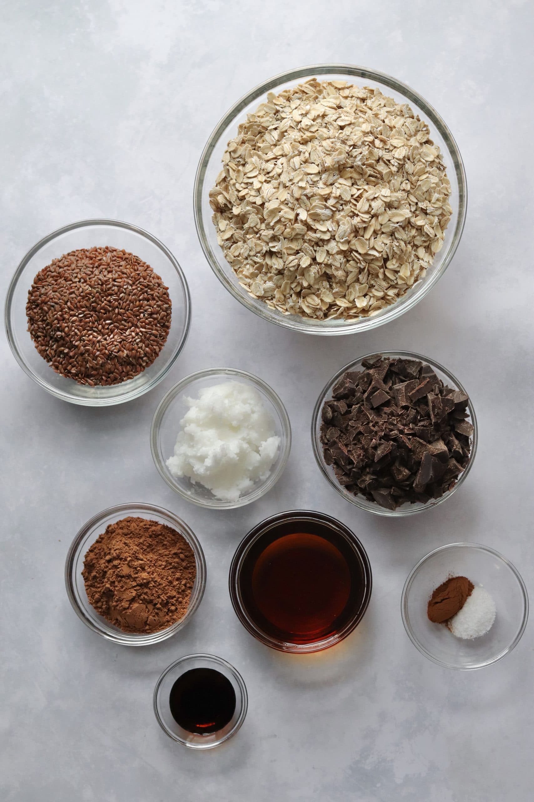 Chocolate granola ingredients in glass bowls