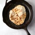 cooked flatbread in skillet