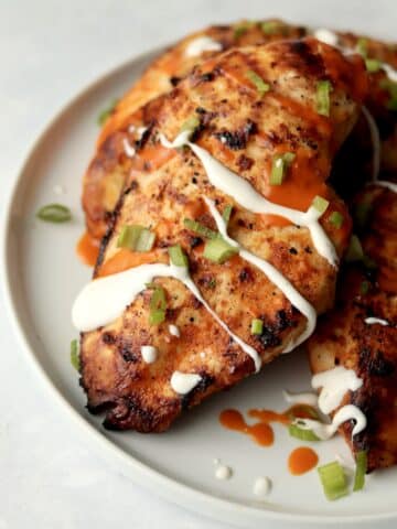 grilled buffalo chicken breasts drizzled with ranch dressing