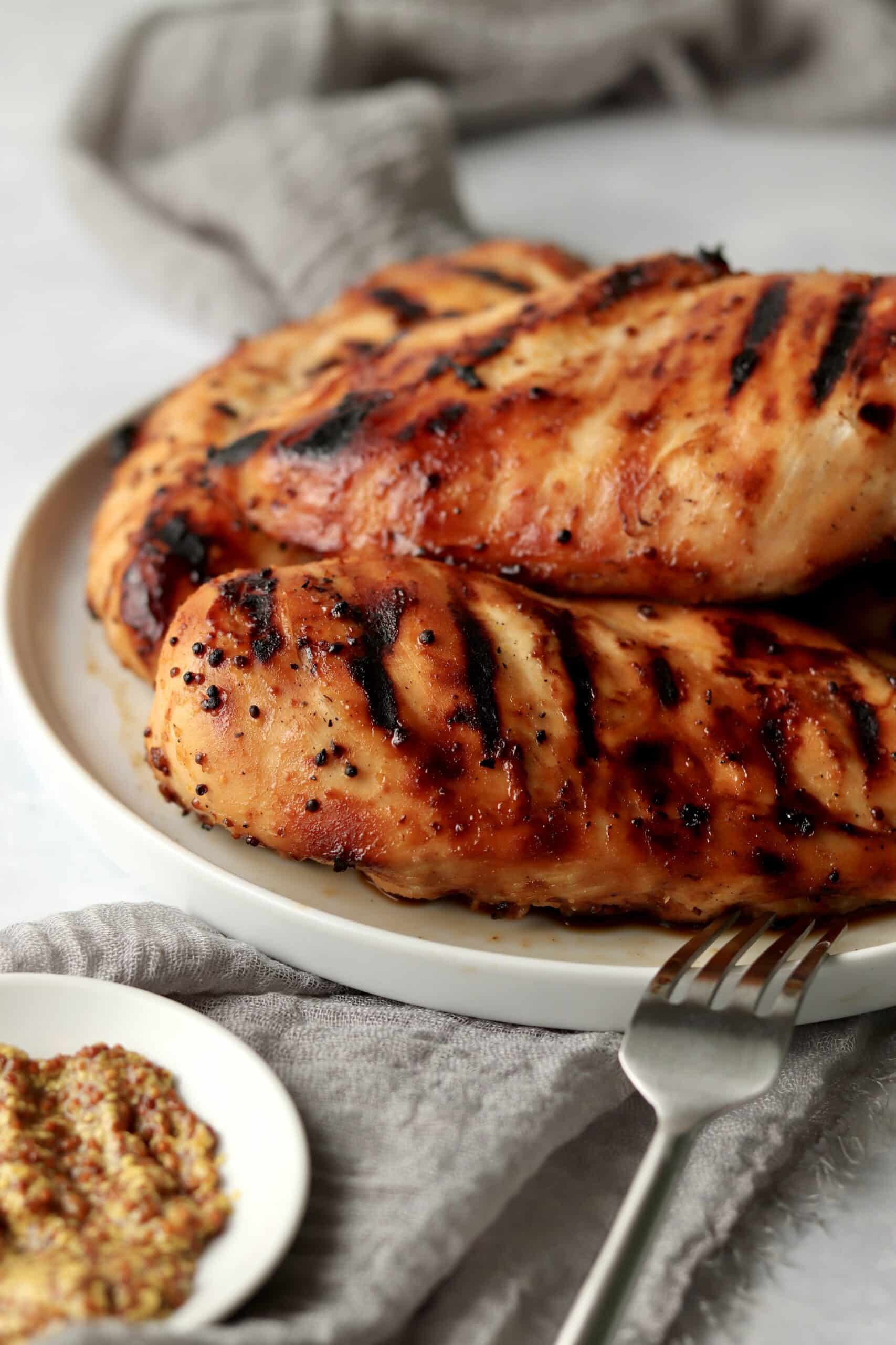 grilled honey mustard chicken breasts on a plate