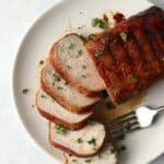 sliced pork tenderloin on the grill