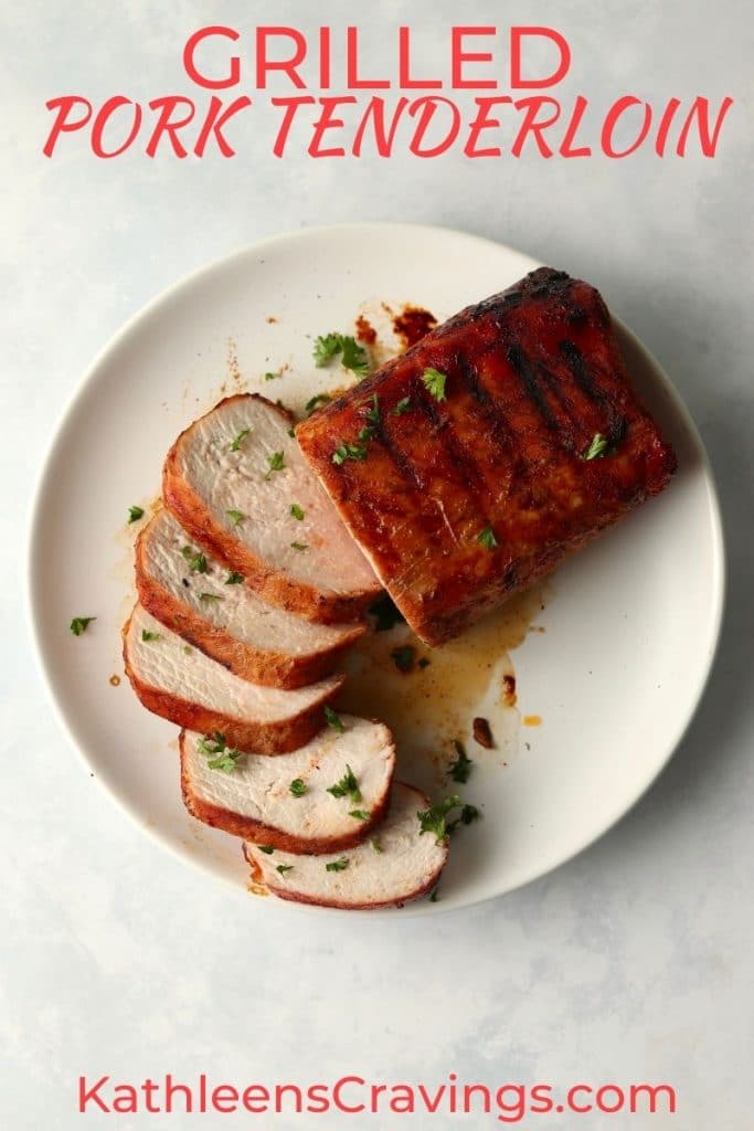 grilled pork tenderloin sliced on a plate