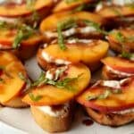 peach ricotta crostini appetizer on plate