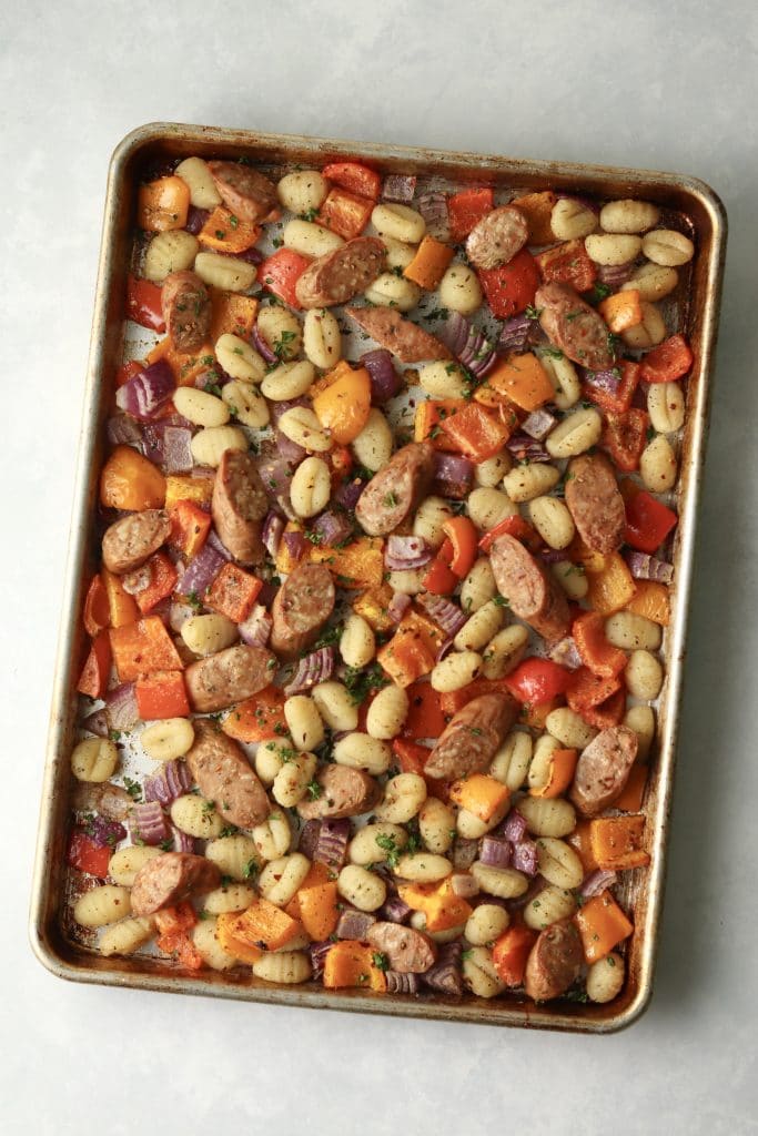 roasted veggies and sausage on a sheet pan