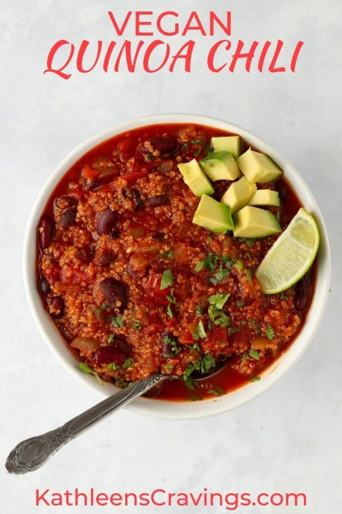 quinoa chili in a bowl topped with avocado