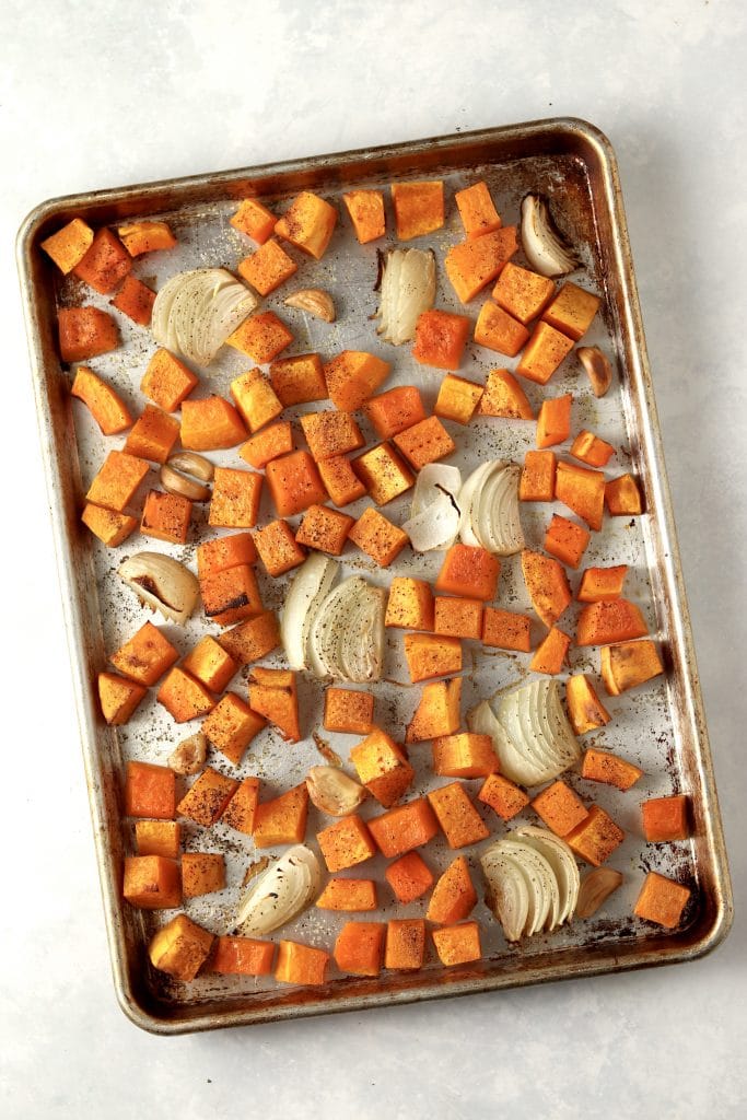 roasted butternut squash, onions, and garlic on sheet pan