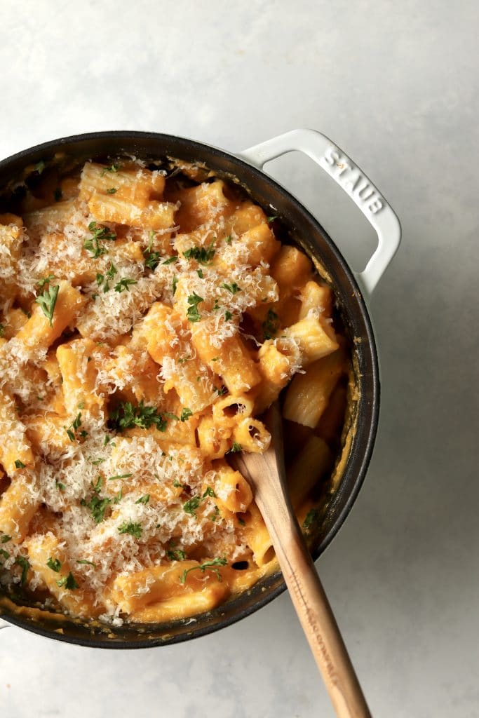 roasted butternut squash pasta in a dutch oven with Parmesan Cheese