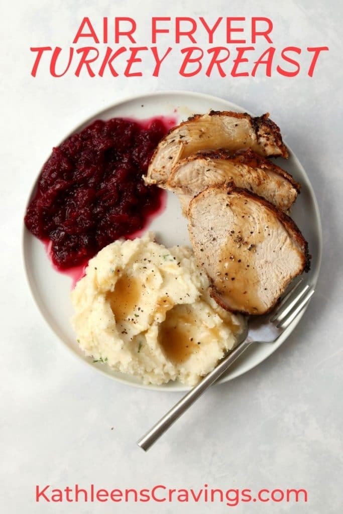 sliced turkey breast with mashed potatoes and cranberry sauce