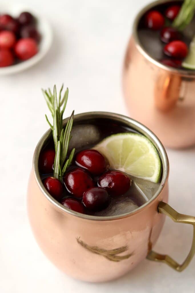 two Moscow mules with cranberries