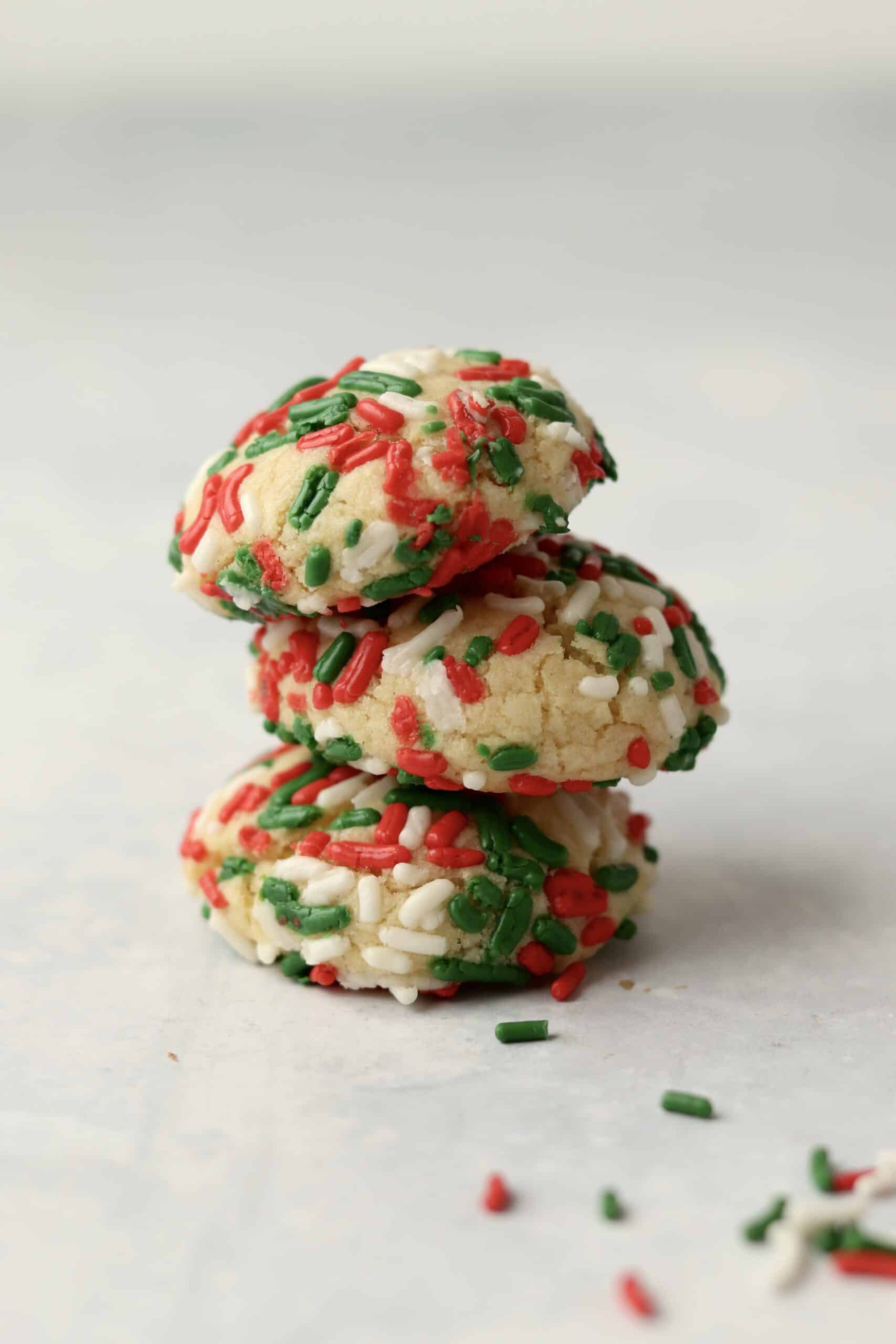 stack of sugar cookies with holiday sprinkles