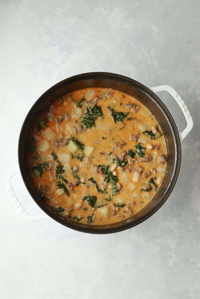 creamy sausage soup with kale in dutch oven
