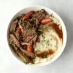 bowl of pot roast with mashed potatoes