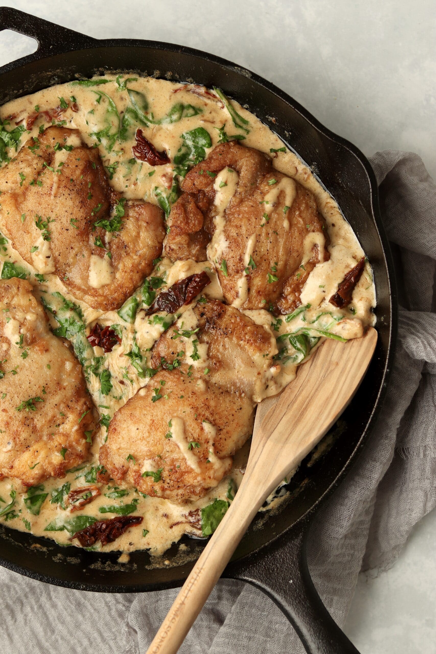sun dried tomato chicken thighs in a skillet