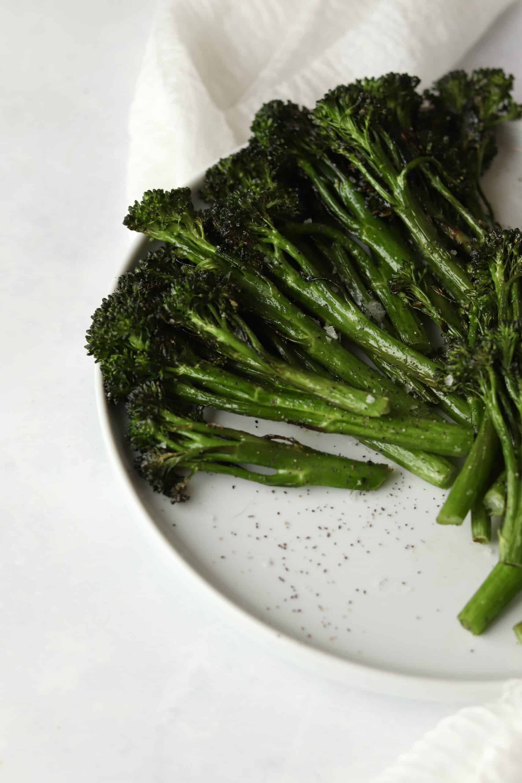 tender roasted broccolini on a plate