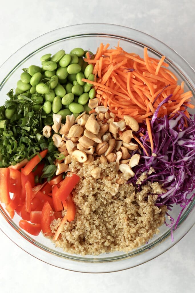 quinoa salad ingredients in glass bowl