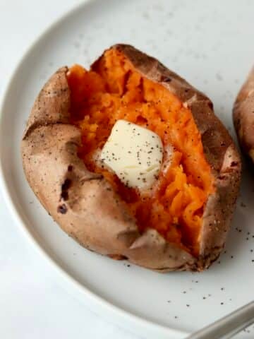 close up of baked sweet potato with butter