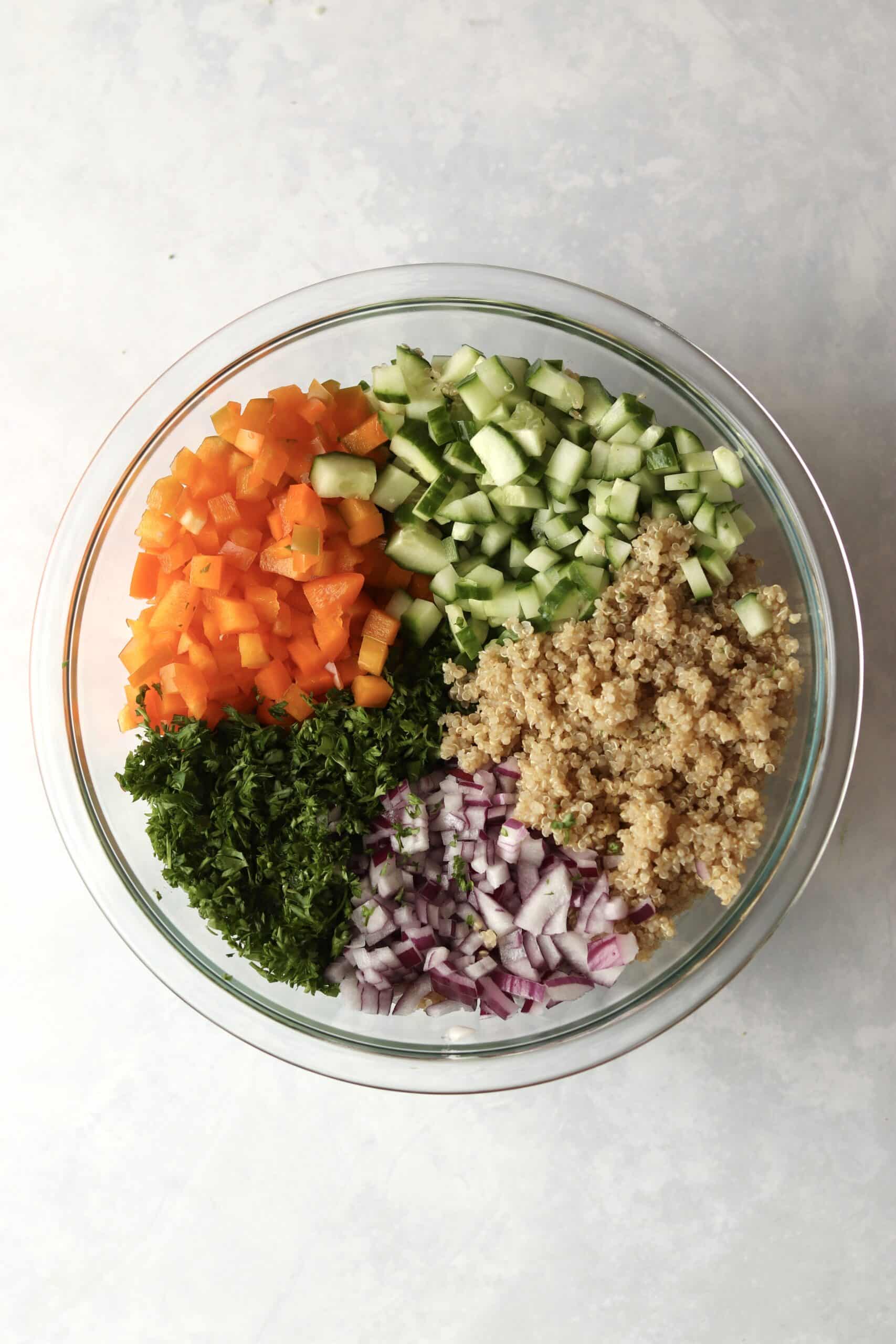 quinoa, cucumber, bell pepper, red onion, and parsley