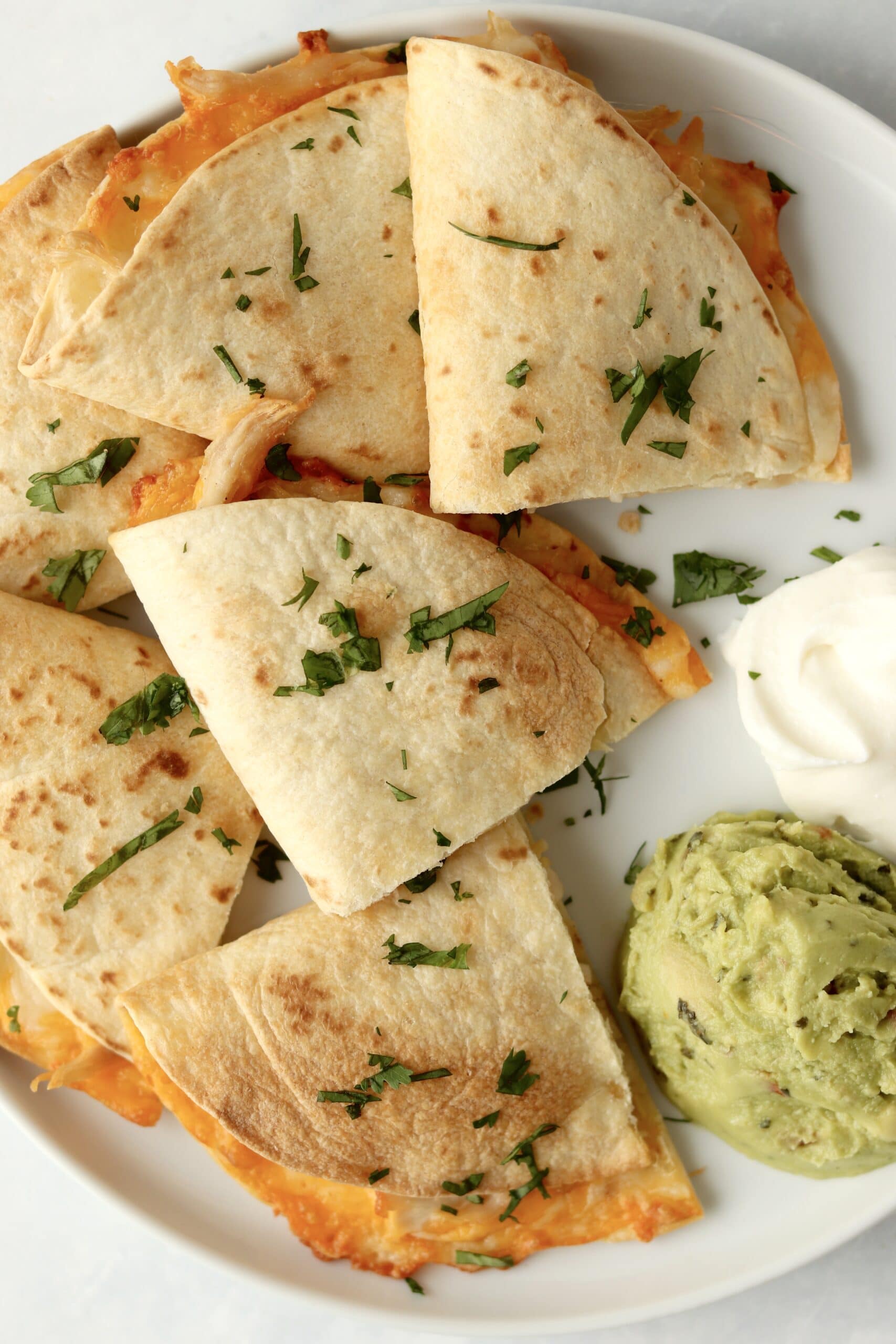 cheese quesadillas with guac and sour cream
