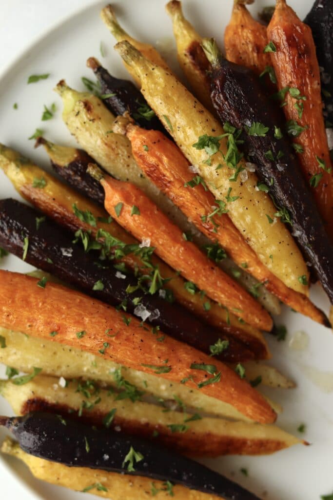 close up of roasted carrots with parsley