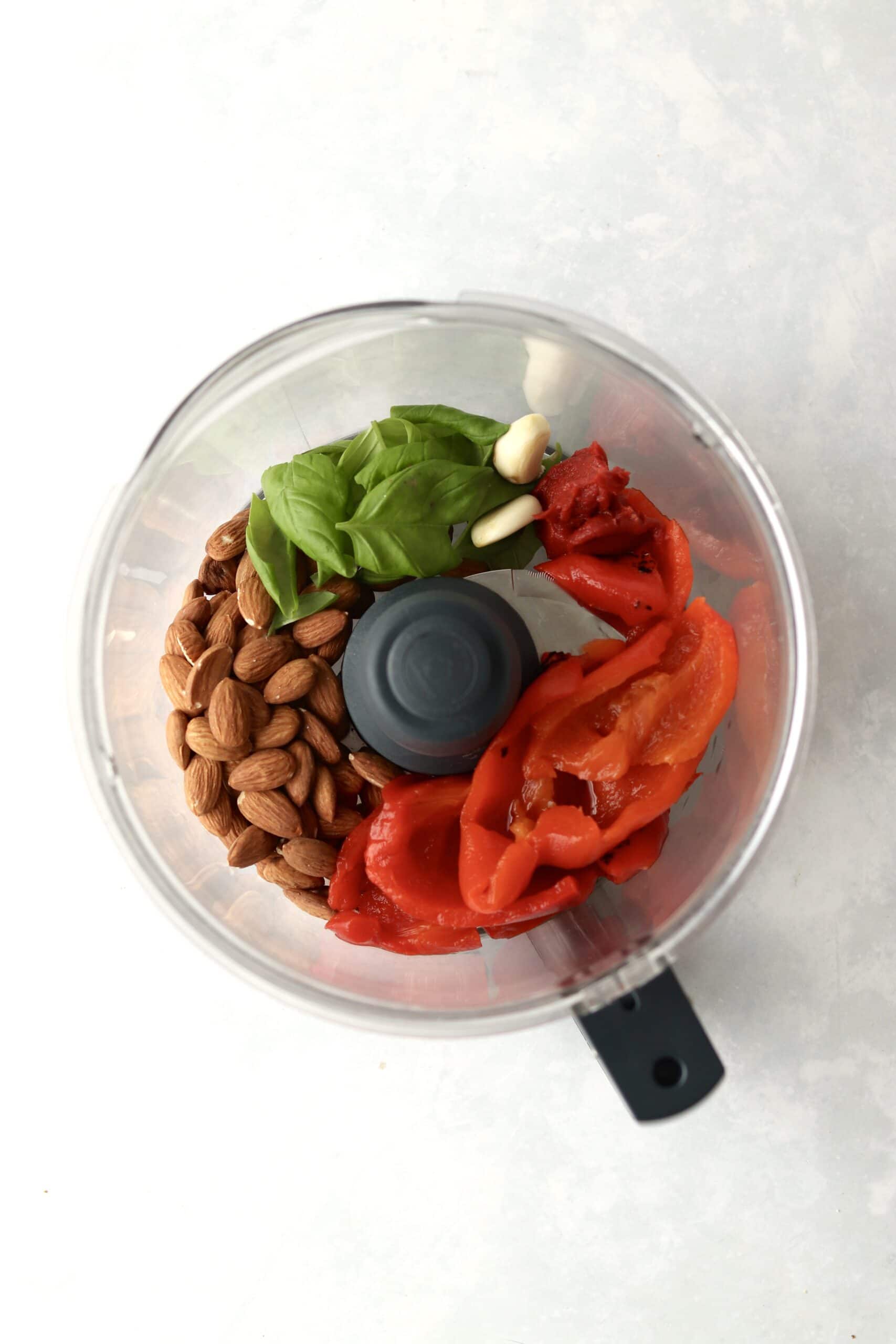 roasted bell peppers, almonds, basil, and garlic in a food processor